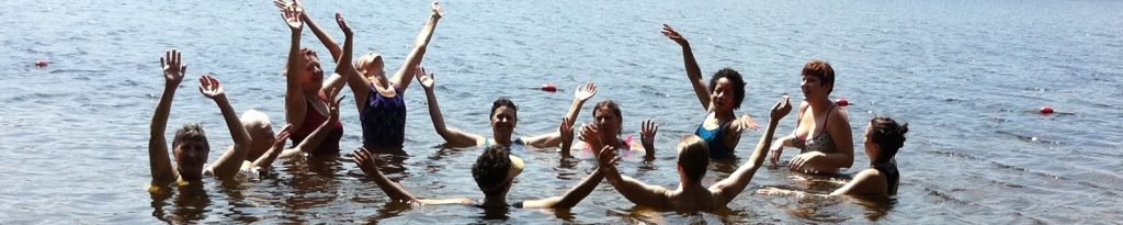 Group of women dancing in the pond 