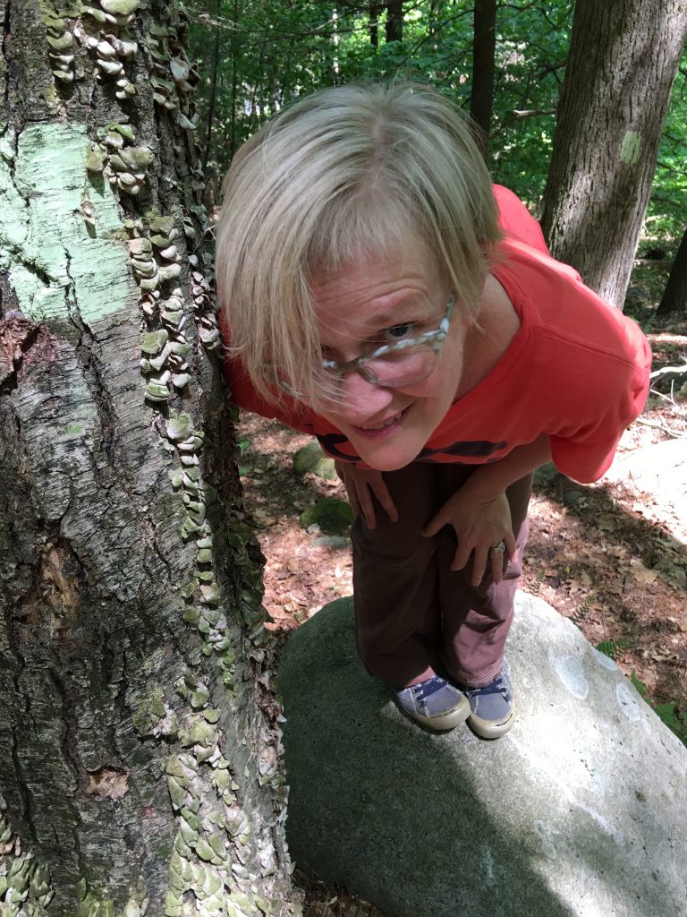 Melinda Buckwalter standing next to tree, from above